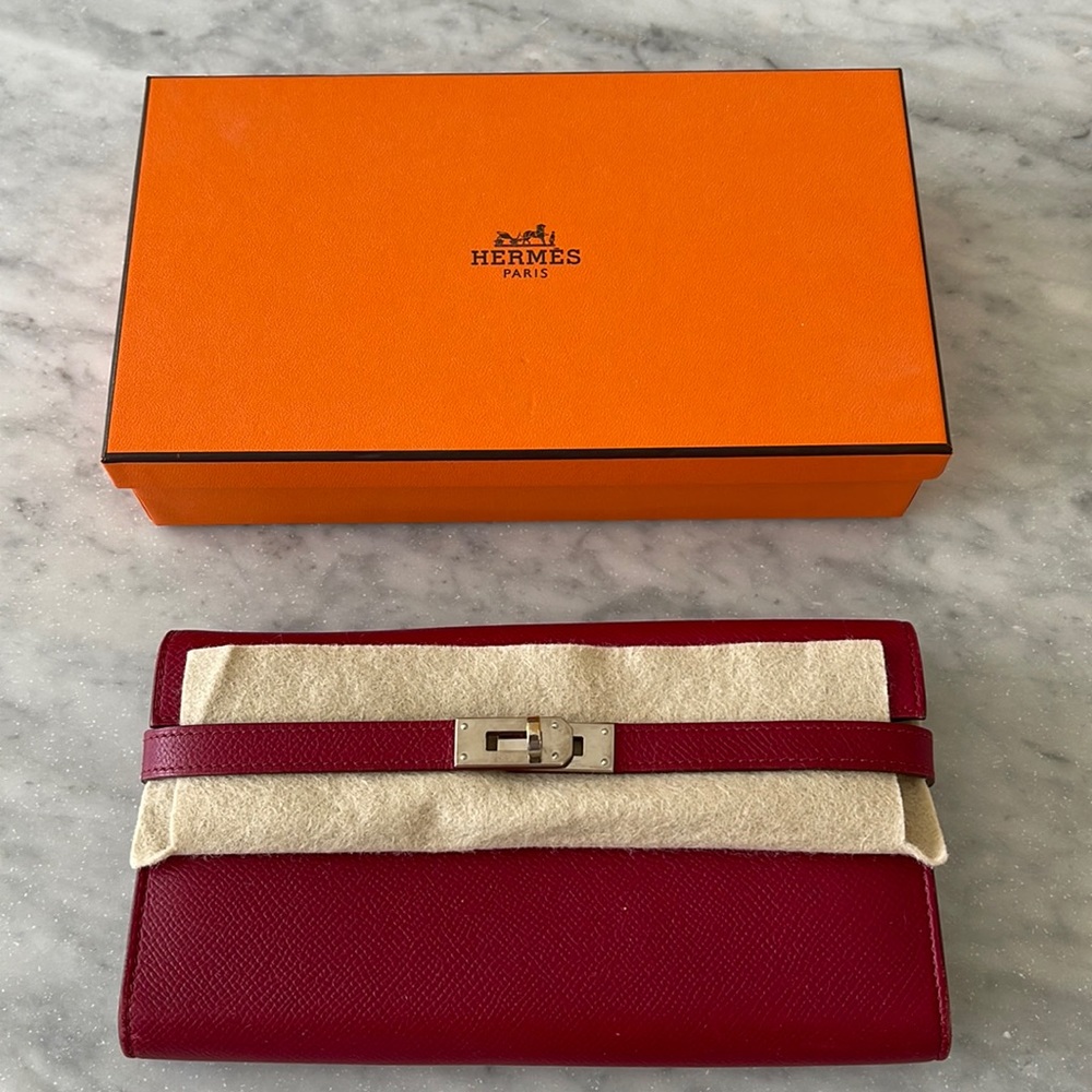 Hermes Kelly Long Wallet (12 CC slots) in Rubis color with palladium hardware.